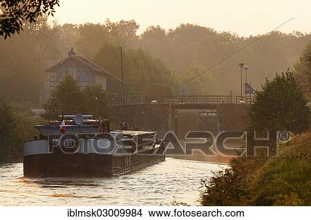 "Early morning on the Canal des Vosges, formerly Canal de l'Est, freighter Joshua at lock No. 41, Selles, Vesoul, Haute-Saone, Franche-Comte, France, Europe" View Large Photo Image Picture - "Early morning on the Canal des Vosges, formerly Canal de l'Est, freighter Joshua at lock No. 41, Selles, Vesoul, Haute-Saone, Franche-Comte, France, Europe". Fotosearch