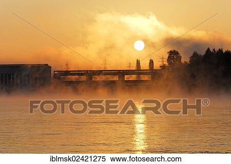 Early morning on the Rhine river, sunrise over Ryburg-Schwoerstadt power plant, Rheinfelden - Baden, Baden-Wuerttemberg, Germany, Europe View Large Photo Image Stock Photography - Early morning on the Rhine river, sunrise over Ryburg-Schwoerstadt power plant, Rheinfelden - Baden, Baden-Wuerttemberg, Germany, Europe. Fotosearch