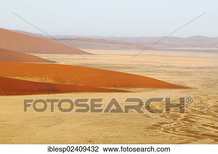 Stock Image - "Early morning view from Dune 45 on a desert landscape with dunes, Tsauchab-Tal, Sossusvlei, Namib-Naukluft-Park, Namib-Wuste, Namibia, Africa". Fotosearch