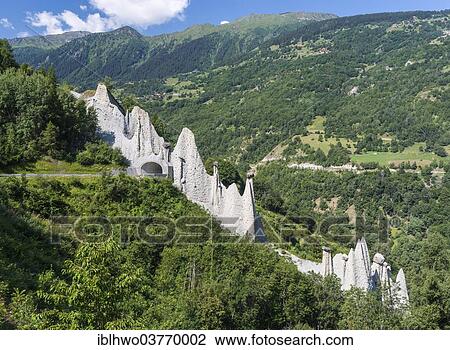 Stock Image - "Earth Pyramids of Euseigne or Pyramides d'Euseigne, natural monument, Val dâ€™Heremence valley, Canton of Valais, Switzerland, Europe". Fotosearch