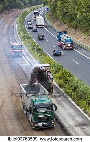 "Earthworks on a large highway construction site on the A52 motorway, near Essen, North Rhine-Westphalia, Germany, Europe" View Large Photo Image Stock Photo - "Earthworks on a large highway construction site on the A52 motorway, near Essen, North Rhine-Westphalia, Germany, Europe". Fotosearch