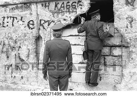 Stock Photography - "East German border guards inspecting damages at the Berlin Wall at the Brandenburg Gate, Berlin, Germany, Europe". Fotosearch