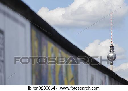 "East Side Gallery with Berlin TV Tower, former Berlin Wall, Muehlenstrasse, Berlin, Germany, Europe" View Large Photo Image Stock Photo - "East Side Gallery with Berlin TV Tower, former Berlin Wall, Muehlenstrasse, Berlin, Germany, Europe". Fotosearch
