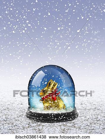 Stock Photo - Easter bunny in a snow dome in snow. Fotosearch