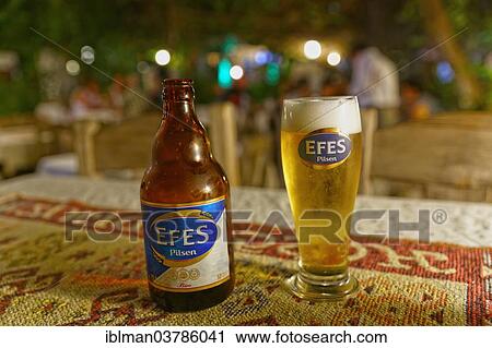 "Efes Pilsen beer bottle and beer glass, Dalyan, Mugla Province, Turkish Riviera or Turquoise Coast, Aegean, Turkey, Asia" View Large Photo Image Stock Image - "Efes Pilsen beer bottle and beer glass, Dalyan, Mugla Province, Turkish Riviera or Turquoise Coast, Aegean, Turkey, Asia". Fotosearch