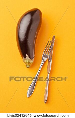 Eggplant, Aubergine (Solanum melongena) with a knife and a fork View Large Photo Image Stock Photography - Eggplant, Aubergine (Solanum melongena) with a knife and a fork. Fotosearch