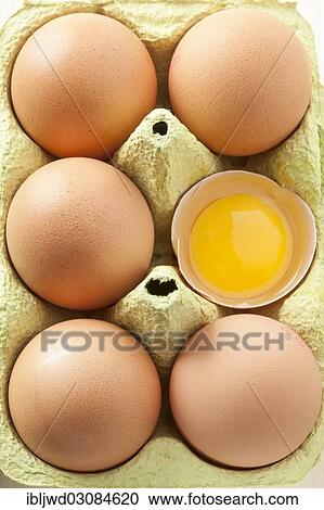 "Eggs in egg carton, one egg open" View Large Photo Image Stock Image - "Eggs in egg carton, one egg open". Fotosearch