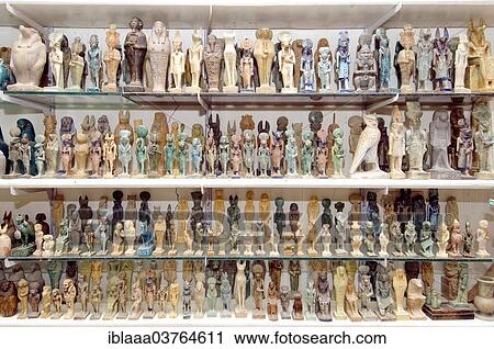 "Egyptian figurines on a shelf in a souvenir shop, Luxor, Luxor Governorate, Egypt, Africa" View Large Photo Image Stock Image - "Egyptian figurines on a shelf in a souvenir shop, Luxor, Luxor Governorate, Egypt, Africa". Fotosearch