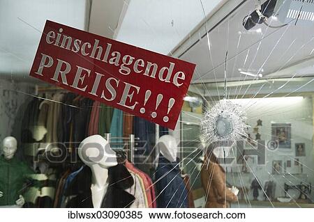 "Einschlagende Preise"""", German for smashing prices, advertising for a fashion store after the shop window made of safety glass was smashed, Baden-Wurttemberg, Germany, Europe" View Large Photo Image Stock Photography - "Einschlagende Preise"""", German for smashing prices, advertising for a fashion store after the shop window made of safety glass was smashed, Baden-Wurttemberg, Germany, Europe". Fotosearch