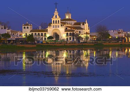 "El Rocio village and Ermita del Rocio hermitage at dusk, El Rocio, Huelva province, Andalusia, Spain, Europe" View Large Photo Image Stock Image - "El Rocio village and Ermita del Rocio hermitage at dusk, El Rocio, Huelva province, Andalusia, Spain, Europe". Fotosearch