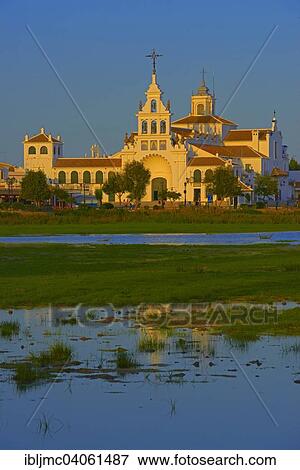 "El Rocio village and Ermita del Rocio hermitage in morning light, El Rocio, Almonte, Marismas de Donana, Huelva province, Andalusia, Spain, Europe" View Large Photo Image Stock Photo - "El Rocio village and Ermita del Rocio hermitage in morning light, El Rocio, Almonte, Marismas de Donana, Huelva province, Andalusia, Spain, Europe". Fotosearch