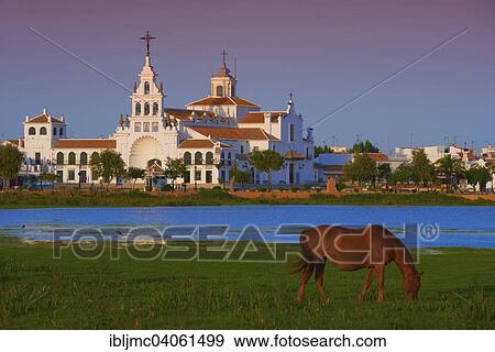 "El Rocio village and Ermita del Rocio hermitage in morning light, El Rocio, Almonte, Marismas de Donana, Huelva province, Andalusia, Spain, Europe" View Large Photo Image Stock Photo - "El Rocio village and Ermita del Rocio hermitage in morning light, El Rocio, Almonte, Marismas de Donana, Huelva province, Andalusia, Spain, Europe". Fotosearch
