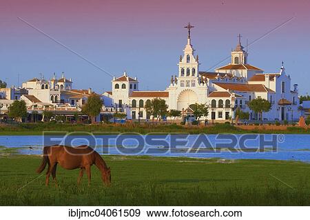 "El Rocio village and Ermita del Rocio hermitage in morning light, El Rocio, Almonte, Marismas de Donana, Huelva province, Andalusia, Spain, Europe" View Large Photo Image Stock Photo - "El Rocio village and Ermita del Rocio hermitage in morning light, El Rocio, Almonte, Marismas de Donana, Huelva province, Andalusia, Spain, Europe". Fotosearch