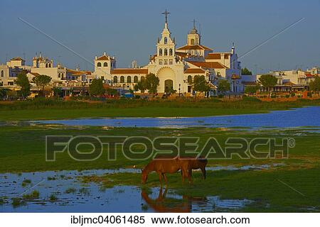 "El Rocio village and Ermita del Rocio hermitage in morning light, El Rocio, Almonte, Marismas de Donana, Huelva province, Andalusia, Spain, Europe" View Large Photo Image Stock Photography - "El Rocio village and Ermita del Rocio hermitage in morning light, El Rocio, Almonte, Marismas de Donana, Huelva province, Andalusia, Spain, Europe". Fotosearch