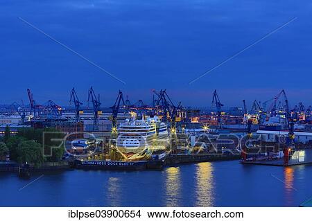 "Elbe 17 dry dock of Blohm and Voss with cruise ship AIDAblu at dusk, Elbe River, Hamburg, Germany, Europe" View Large Photo Image Picture - "Elbe 17 dry dock of Blohm and Voss with cruise ship AIDAblu at dusk, Elbe River, Hamburg, Germany, Europe". Fotosearch