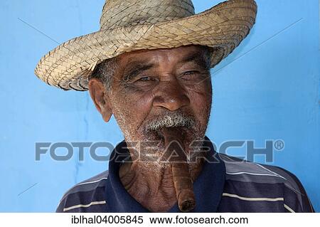 "Elderly Cuban man smoking a cigar, portrait, Vinales, Cuba, North America" View Large Photo Image Stock Photography - "Elderly Cuban man smoking a cigar, portrait, Vinales, Cuba, North America". Fotosearch