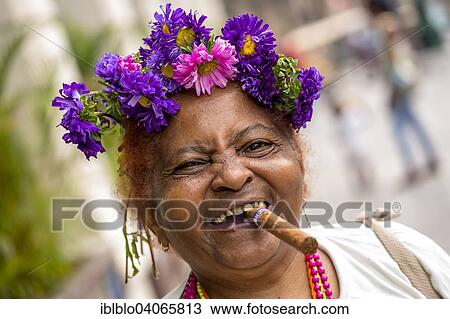 "Elderly Cuban woman with flower headdress and cigar, Havana, Cuba, North America" View Large Photo Image Stock Image - "Elderly Cuban woman with flower headdress and cigar, Havana, Cuba, North America". Fotosearch