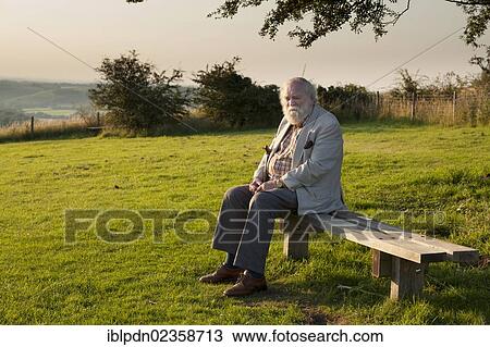 "Elderly gentleman sat on bench in country park, Buriton, Hampshire, England, United Kingdom, Europe" View Large Photo Image Stock Image - "Elderly gentleman sat on bench in country park, Buriton, Hampshire, England, United Kingdom, Europe". Fotosearch