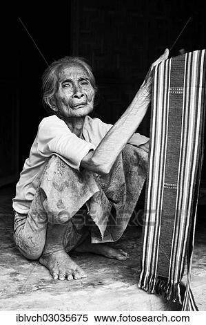 "Elderly Indonesian woman selling fabrics, Terara, Lombok island, Nusa Tenggara Barat Province, Indonesia, Asia" View Large Photo Image Stock Photography - "Elderly Indonesian woman selling fabrics, Terara, Lombok island, Nusa Tenggara Barat Province, Indonesia, Asia". Fotosearch