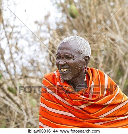 "Elderly Maasai man wearing traditional dress, Massai Mara, Distrikt Narok, Serengeti, Rift Valley province, Kenya, Africa" View Large Photo Image Picture - "Elderly Maasai man wearing traditional dress, Massai Mara, Distrikt Narok, Serengeti, Rift Valley province, Kenya, Africa". Fotosearch