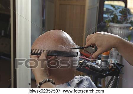 Stock Photo - "Elderly man at a hairdresser's, hair cutting, Baden-Wuerttemberg, Germany, Europe". Fotosearch