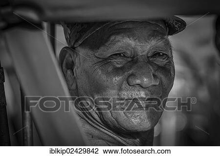 Stock Image - "Elderly man from Chiang Mai, portrait, northern Thailand, Asia". Fotosearch
