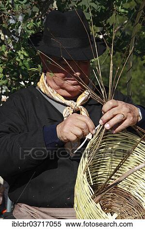 "Elderly man in traditional costume making a basket at a traditional handicraft fair, Ibiza, Spain, Europe" View Large Photo Image Stock Photography - "Elderly man in traditional costume making a basket at a traditional handicraft fair, Ibiza, Spain, Europe". Fotosearch
