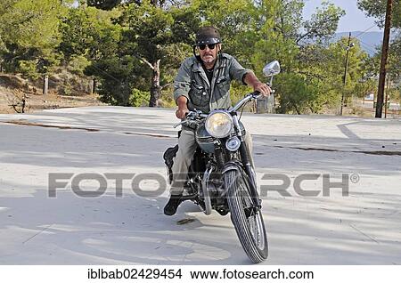 "Elderly man riding a Triumph Tiger 500cc motorbike, built in 1956, English motorcycle, Altea, Costa Blanca, Spain, Europe, PublicGround, Europe" View Large Photo Image Picture - "Elderly man riding a Triumph Tiger 500cc motorbike, built in 1956, English motorcycle, Altea, Costa Blanca, Spain, Europe, PublicGround, Europe". Fotosearch