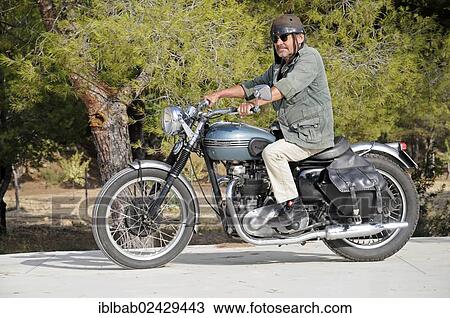"Elderly man riding a Triumph Tiger 500cc motorbike, built in 1956, English motorcycle, Altea, Costa Blanca, Spain, Europe, PublicGround, Europe" View Large Photo Image Stock Image - "Elderly man riding a Triumph Tiger 500cc motorbike, built in 1956, English motorcycle, Altea, Costa Blanca, Spain, Europe, PublicGround, Europe". Fotosearch