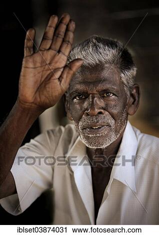 Stock Image - "Elderly man waving, Kerala, South India, India, Asia". Fotosearch