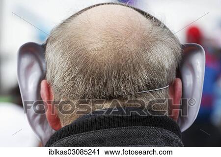 "Elderly man wearing a carnival mask with big ears, rear view, Dusseldorf, Rhineland, North Rhine-Westphalia, Germany, Europe" View Large Photo Image Stock Image - "Elderly man wearing a carnival mask with big ears, rear view, Dusseldorf, Rhineland, North Rhine-Westphalia, Germany, Europe". Fotosearch