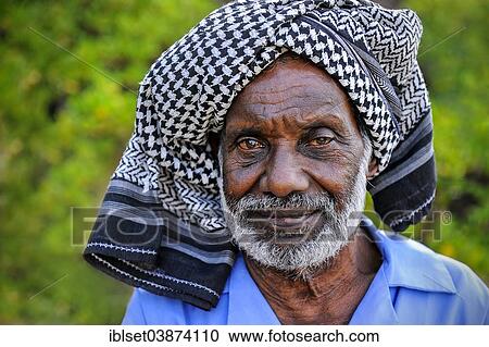 Stock Image - "Elderly man wearing a headscarf, portrait, Kerala, South India, India, Asia". Fotosearch