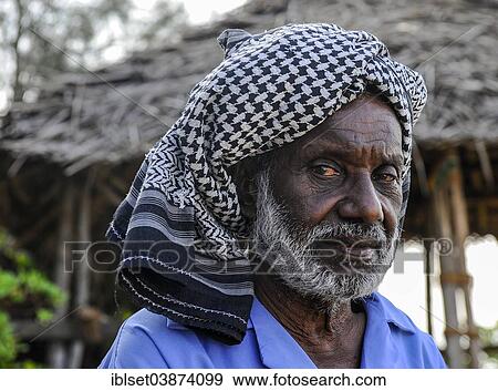 Stock Photo - "Elderly man wearing a headscarf, portrait, Kerala, South India, India, Asia". Fotosearch