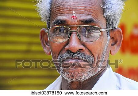 Stock Image - "Elderly man wearing glasses, portrait, Kerala, South India, India, Asia". Fotosearch