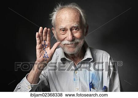 Stock Photo - Elderly man with a chemical formula written on his hand. Fotosearch