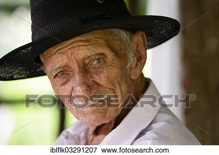 Stock Photo - "Elderly man with a hat, portrait, Poxoreo, Mato Grosso, Brazil, South America". Fotosearch