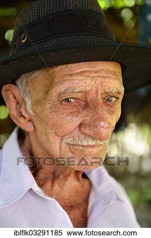 Stock Photography - "Elderly man with a hat, portrait, Poxoreo, Mato Grosso, Brazil, South America". Fotosearch