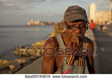 "Elderly man with cigars on the Malecon promenade, Havana, Cuba, North America" View Large Photo Image Stock Photo - "Elderly man with cigars on the Malecon promenade, Havana, Cuba, North America". Fotosearch