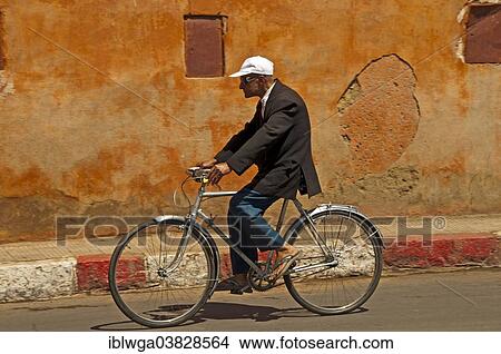 "Elderly Moroccan riding a bicycle, Marrakech, Morocco, Africa" View Large Photo Image Picture - "Elderly Moroccan riding a bicycle, Marrakech, Morocco, Africa". Fotosearch