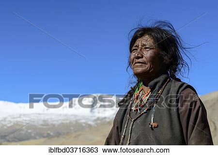 "Elderly nomad woman, snow covered mountains in the distance, Korzok, Ladakh, Jammu and Kashmir, India, Asia" View Large Photo Image Stock Image - "Elderly nomad woman, snow covered mountains in the distance, Korzok, Ladakh, Jammu and Kashmir, India, Asia". Fotosearch