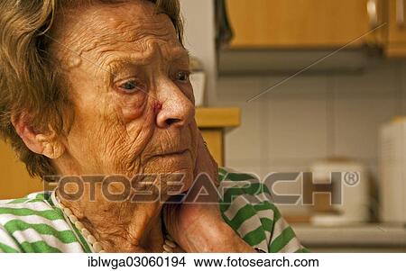 Picture - "Elderly woman, 86, marked by age and extended periods of illness, in an assisted living facility". Fotosearch