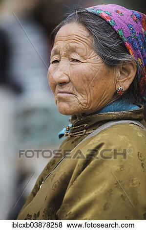 "Elderly woman, portrait, wearing a traditional deel, in the Buddhist Gandan Monastery, Ulaanbaatar, Mongolia, Asia" View Large Photo Image Stock Photo - "Elderly woman, portrait, wearing a traditional deel, in the Buddhist Gandan Monastery, Ulaanbaatar, Mongolia, Asia". Fotosearch