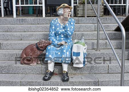"Elderly woman with a dog, sculpture on stairs, Heringsdorf, Usedom Island, Mecklenburg-Western Pomerania, Germany, Europe" View Large Photo Image Stock Image - "Elderly woman with a dog, sculpture on stairs, Heringsdorf, Usedom Island, Mecklenburg-Western Pomerania, Germany, Europe". Fotosearch