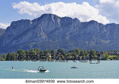 "Electric boats on Mondsee Lake with Mt Drachenwand, Salzkammergut, Upper Austria, Austria, Europe" View Large Photo Image Stock Photo - "Electric boats on Mondsee Lake with Mt Drachenwand, Salzkammergut, Upper Austria, Austria, Europe". Fotosearch