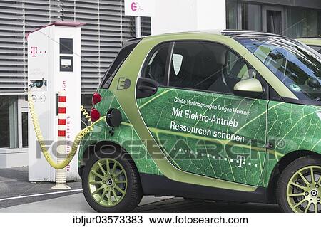"Electric car being charged in a charging socket at the front of the Telekom-Zentrale headquarters, Bonn, North Rhine-Westphalia, Germany, Europe" View Large Photo Image Stock Image - "Electric car being charged in a charging socket at the front of the Telekom-Zentrale headquarters, Bonn, North Rhine-Westphalia, Germany, Europe". Fotosearch
