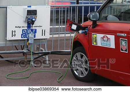 "Electric car being recharged at a charging station, Rallye Monte-Carlo des Energies Nouvelles in 2014, Principality of Monaco" View Large Photo Image Picture - "Electric car being recharged at a charging station, Rallye Monte-Carlo des Energies Nouvelles in 2014, Principality of Monaco". Fotosearch