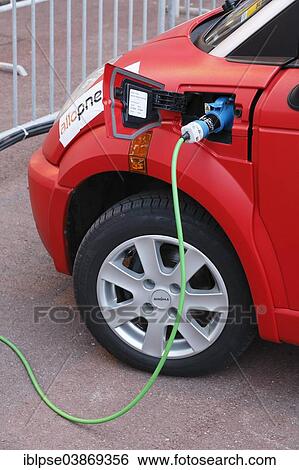 Stock Photograph - "Electric car being recharged at a charging station, Rallye Monte-Carlo des Energies Nouvelles in 2014, Principality of Monaco". Fotosearch