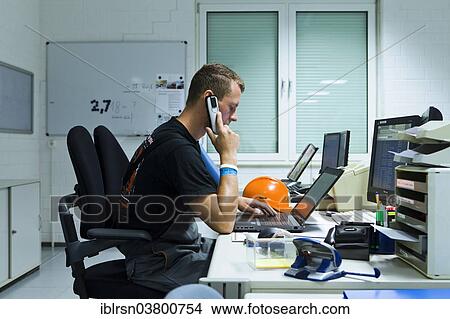 Picture - "Electrician performing maintenance work on the substation premises of Transmission Control Center, TCC, of transmission network operator 50Hertz, Neuenhagen, Brandenburg, Germany, Europe". Fotosearch