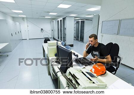 "Electrician performing maintenance work on the substation premises of Transmission Control Center, TCC, of transmission network operator 50Hertz, Neuenhagen, Brandenburg, Germany, Europe" View Large Photo Image Stock Photography - "Electrician performing maintenance work on the substation premises of Transmission Control Center, TCC, of transmission network operator 50Hertz, Neuenhagen, Brandenburg, Germany, Europe". Fotosearch