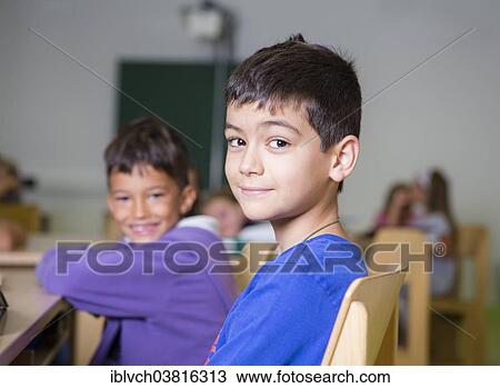 "Elementary school children with an immigrant background sitting in a primary school class, Reith im Alpbachtal, Kufstein District, Tyrol, Austria, Europe" View Large Photo Image Stock Image - "Elementary school children with an immigrant background sitting in a primary school class, Reith im Alpbachtal, Kufstein District, Tyrol, Austria, Europe". Fotosearch